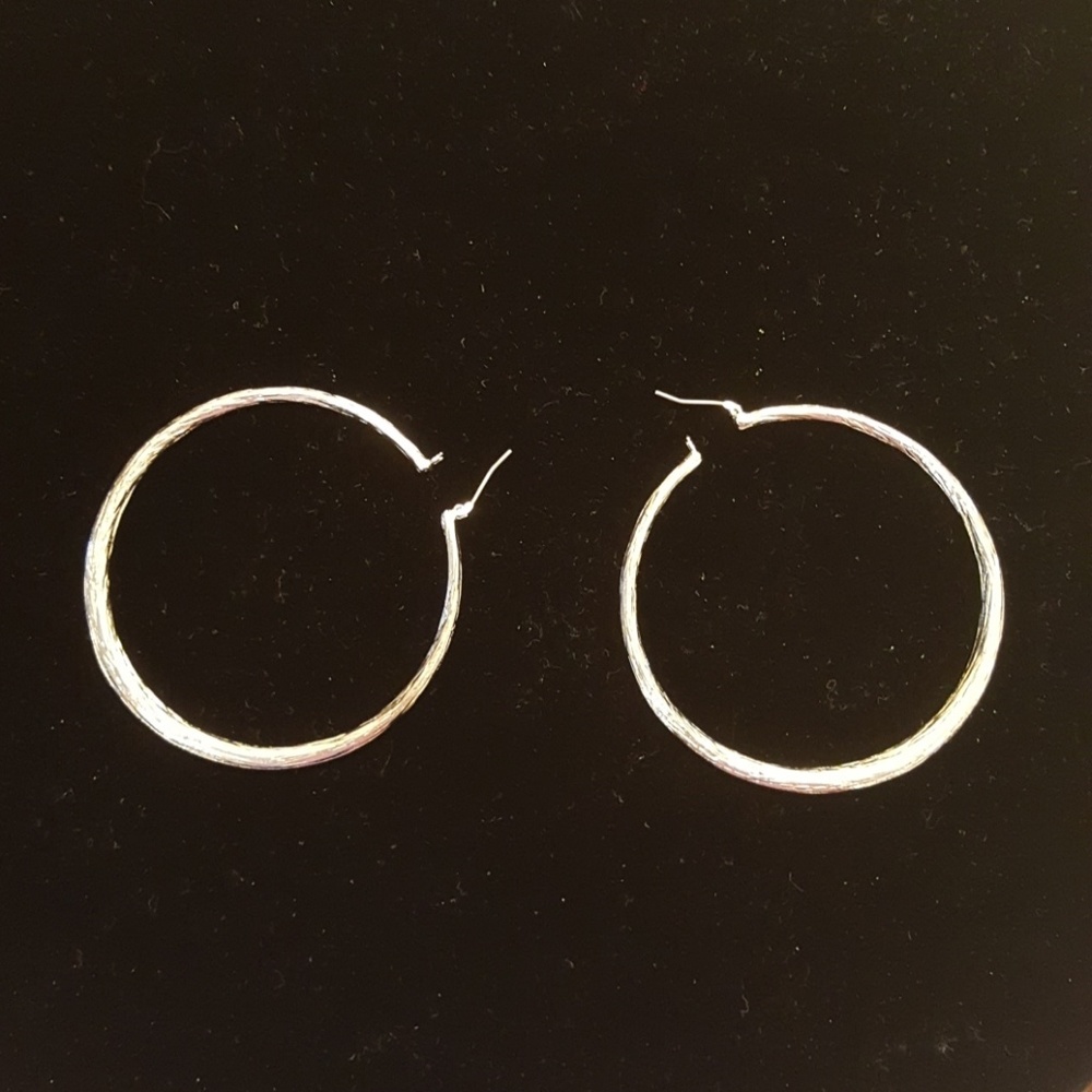 Silvertone hollow hoop earrings
